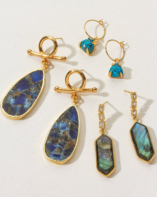 Collection of three gold statement hoop and post earrings in labradorite, quartz, and turquoise.