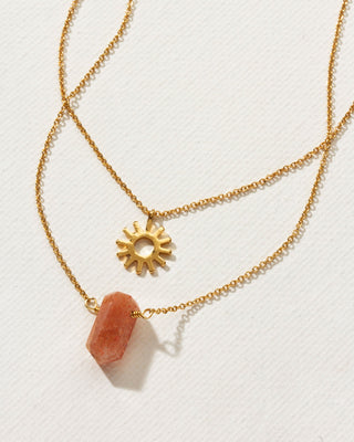 Gold sunstone layered necklace with a gold sun charm by Luna Norte Jewelry.