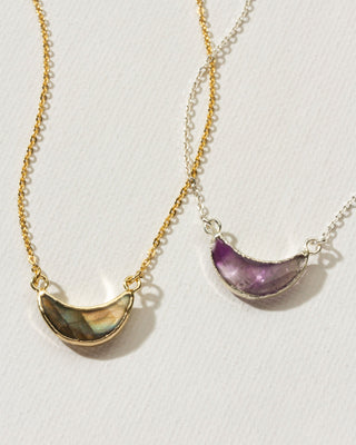 Collection showing gold and silver amethyst and labradorite crescent moon necklaces by Luna Norte.