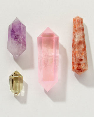 Pink, purple, orange, and clear double point crystal wand curios by Luna Norte.