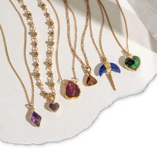 Decorative design showing six of Luna Norte's bestselling genuine gemstone necklaces .