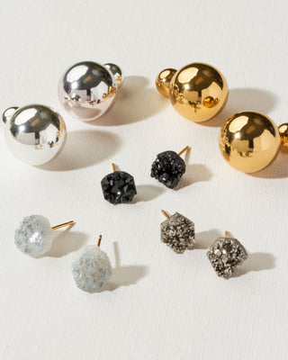 Several pairs of gold, silver, quartz, and pyrite post earrings by Luna Norte Jewelry.