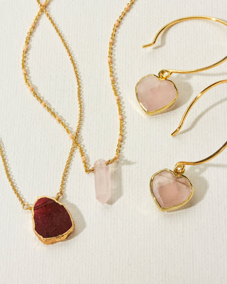 Collection of Garnet and Rose Quartz earrings and necklaces, January's birthstones.