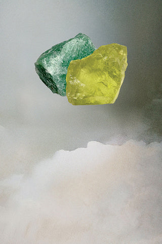 Raw Peridot and Green Aventurine crystals on a cloudy surface