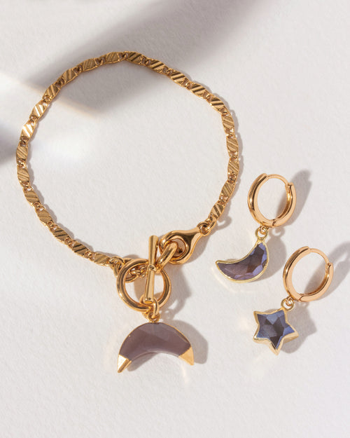 Adorned Sky Gazer gold bracelet and hoop earrings with moon and star charms