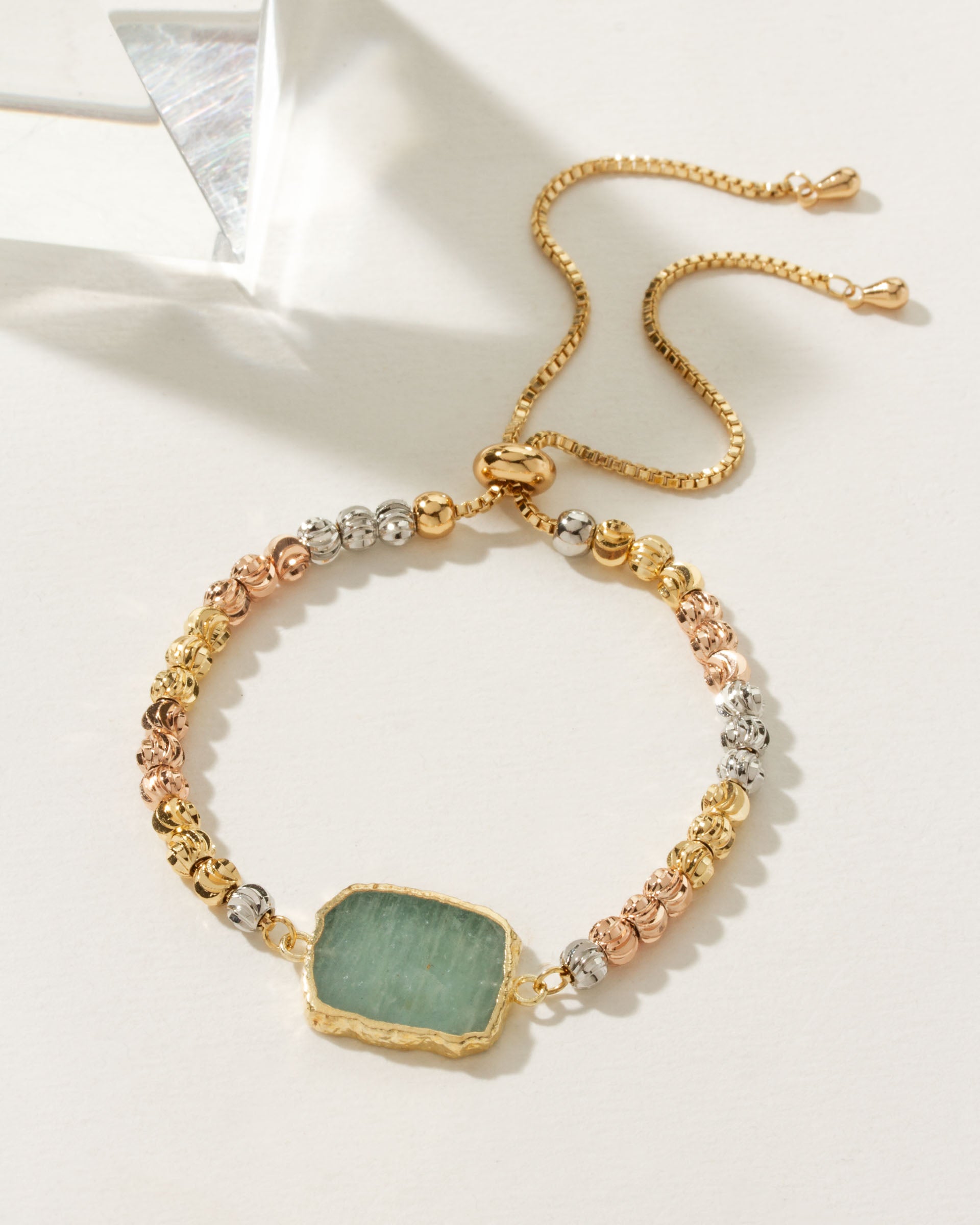 Eterno Amore bracelet with silver, gold, and rose gold beads, featuring an Aquamarine gemstone.