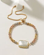 Eterno Amore Gemma Adjustable Bracelet with Mother of Pearl stone and three-tone faceted beads.