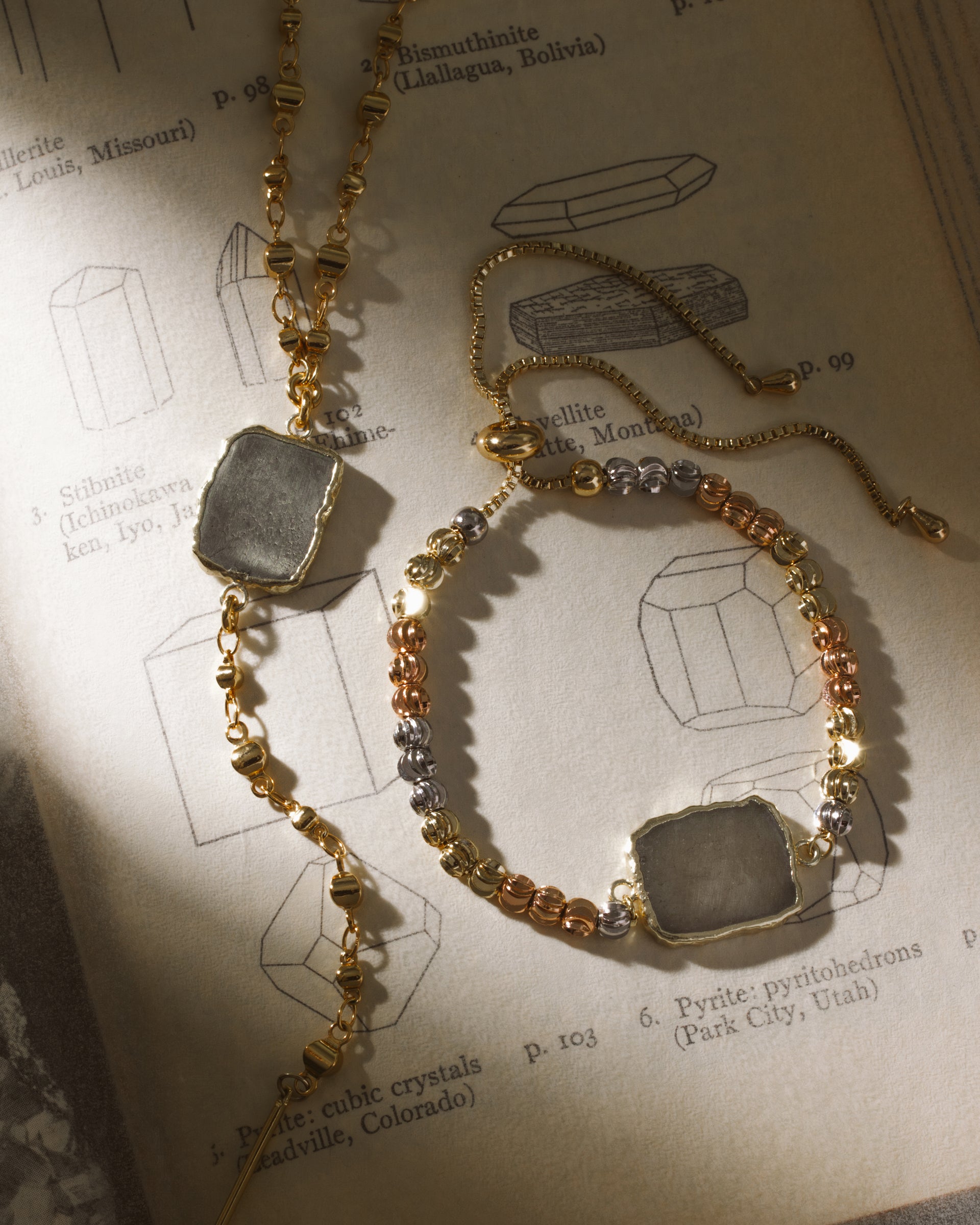 Eterno Amore bracelet with pyrite stone and tri-tone plated beads, on a page describing minerals.
