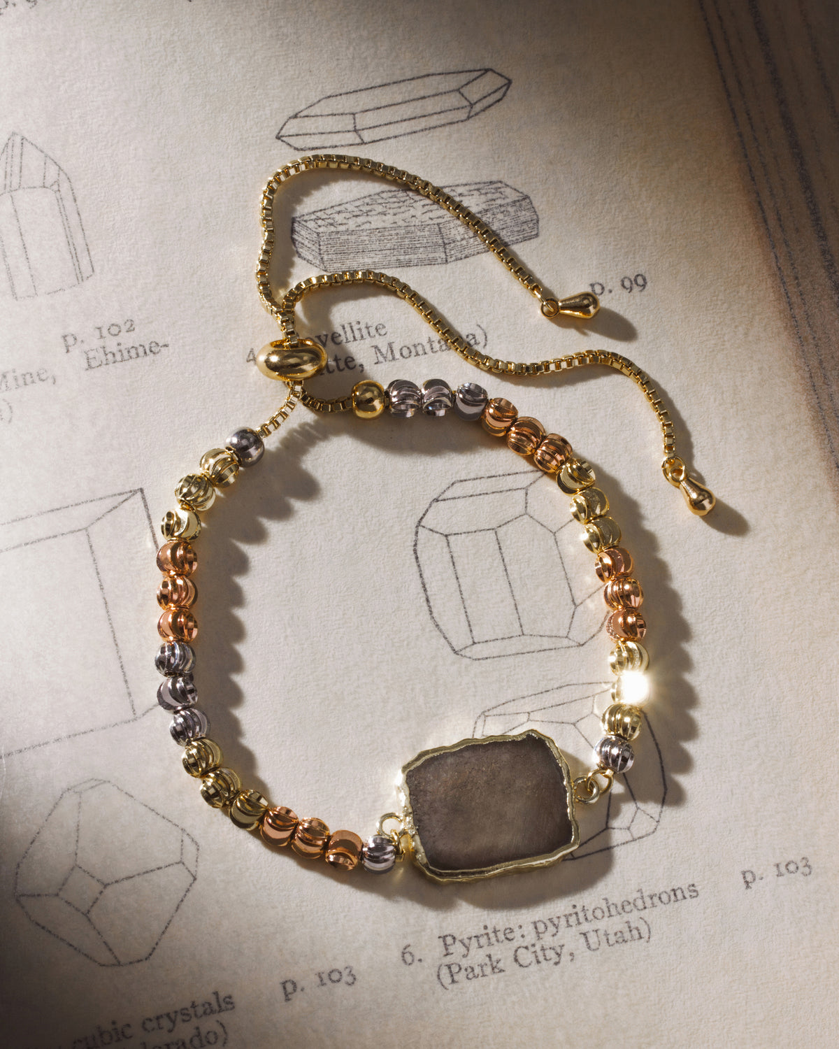 Eterno Amore bracelet with pyrite stone and silver, gold, and rose gold plated beads.