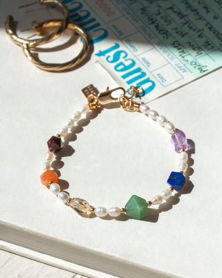 Bracelet with colorful beads on a book