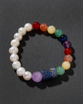 Multicolored beaded bracelet on a dark gray background