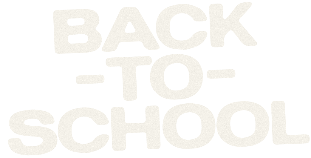 Young woman wearing gemstone jewelry hanging out in her bedroom, overlaid with text “BACK TO SCHOOL”