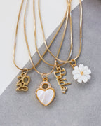 Four gold snake-chain necklaces with 2025, Bride, crystal heart lock, and pearl flower pendants