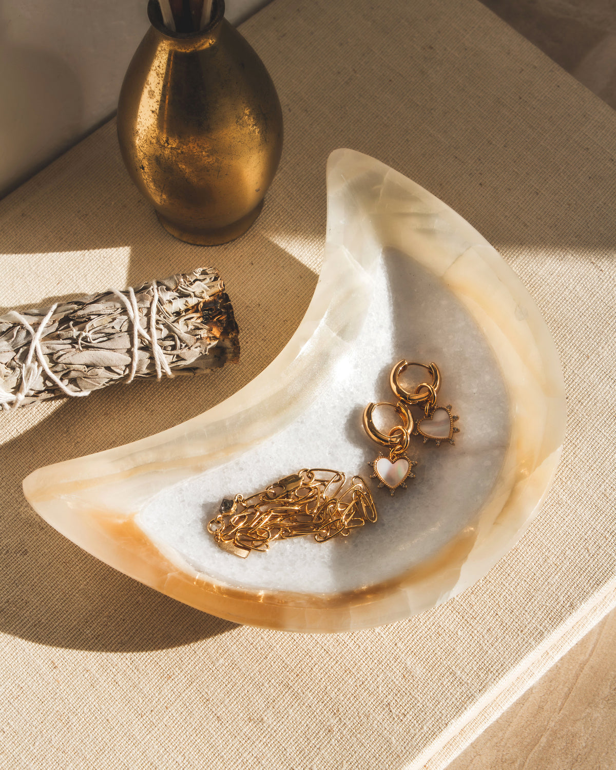 A moon-shaped catch-all dish, carved from calcite