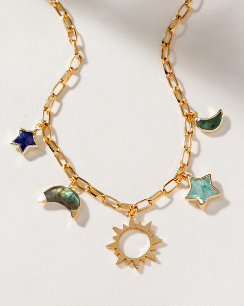 Gold-plated paperclip charm necklace with multicolor moon, star, and sun charms