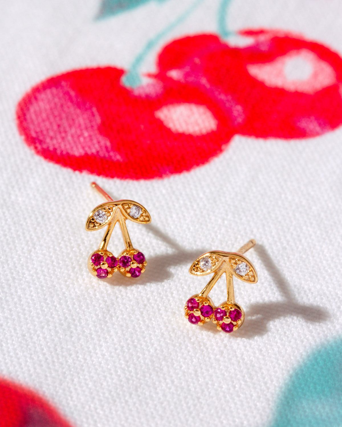 14KT Gold plated sterling silver cherry earrings with red stones and clear stones.