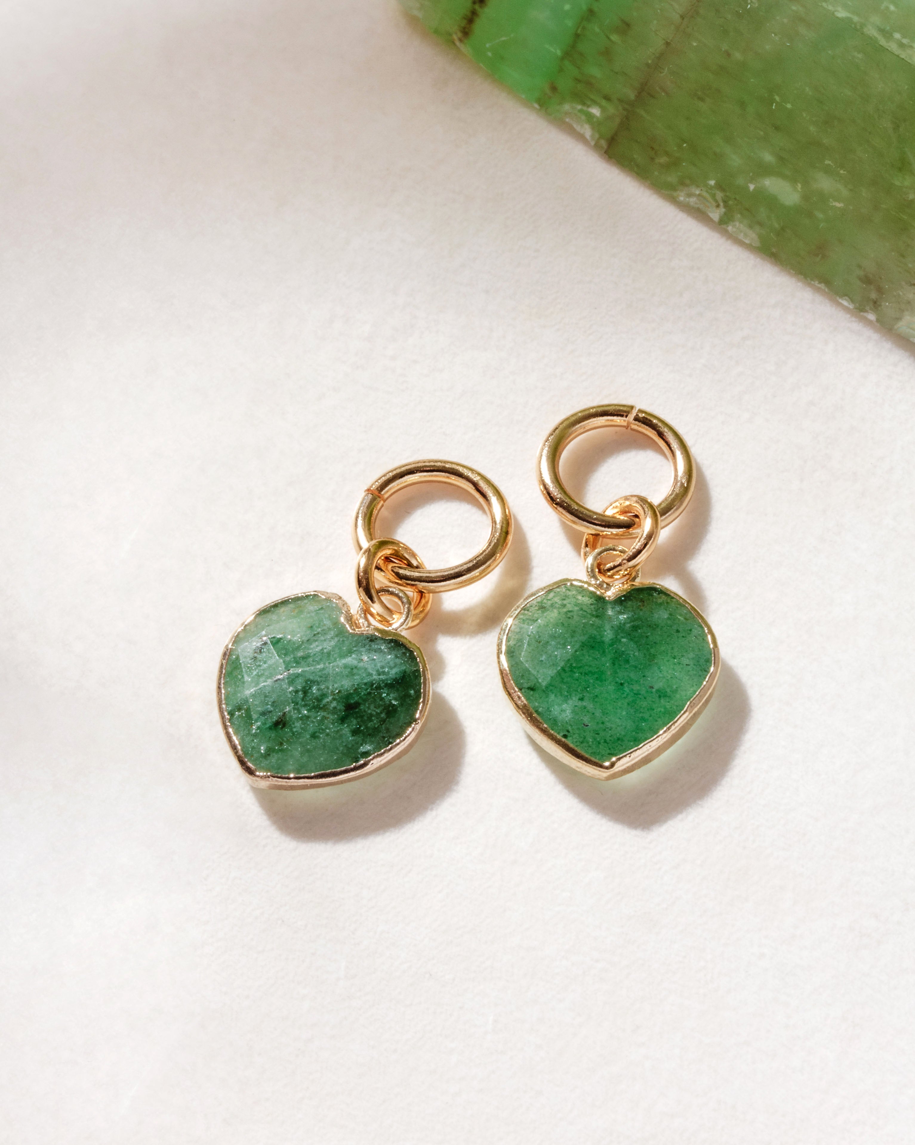 Pair of interchangeable hoop earring charms with heart shaped green strawberry quartz gemstones