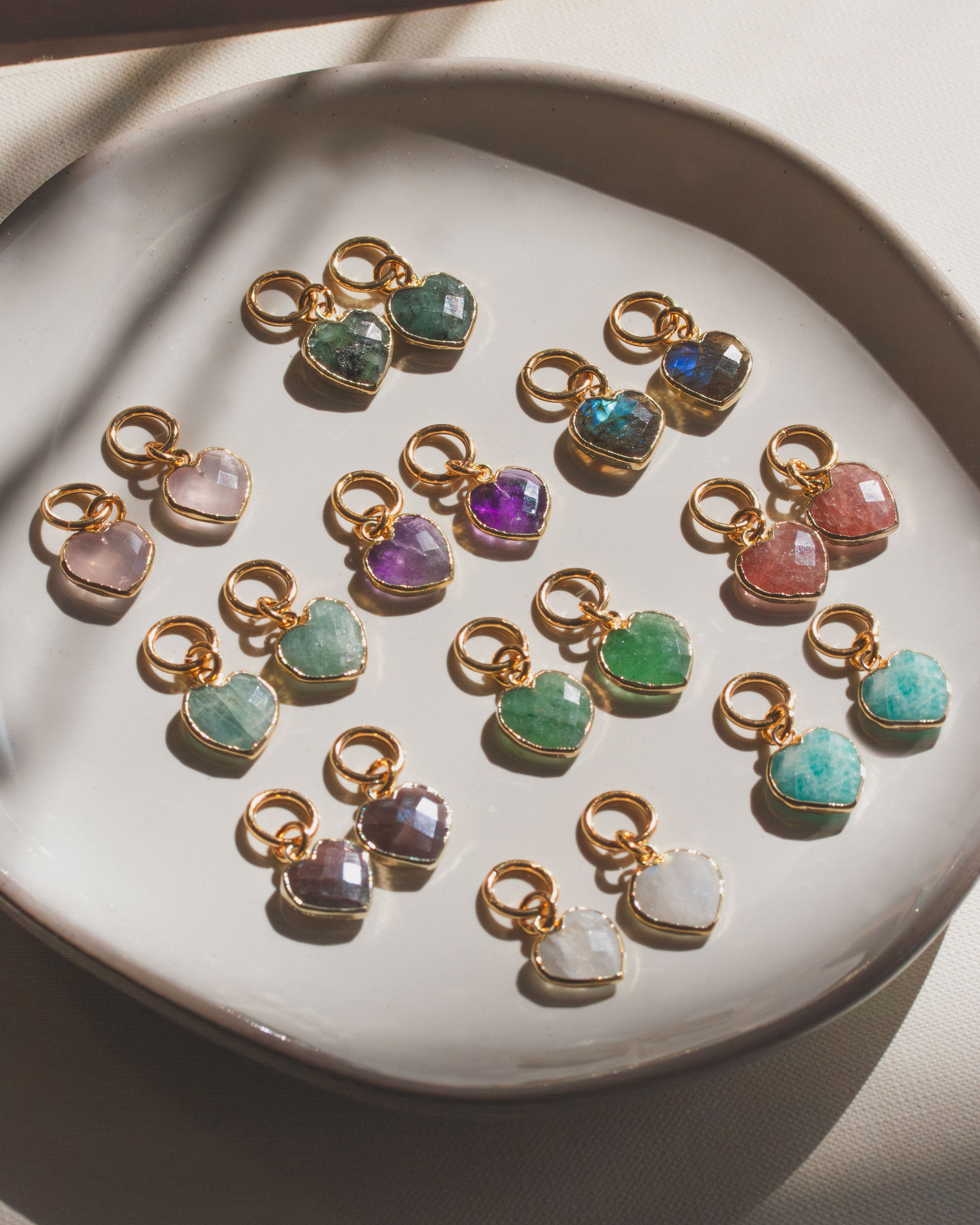 Collection of interchangeable hoop earring charms with various colored gemstones