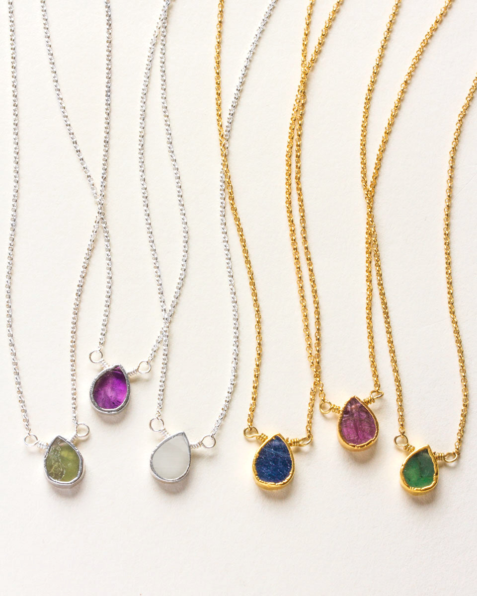 Collection of Gemstone Birthstone Necklace in both Silver and gold-plated with several birthstones.