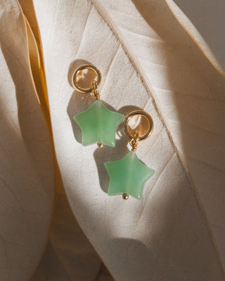 Two interchangeable hoop green aventurine earring charms with a star shape.