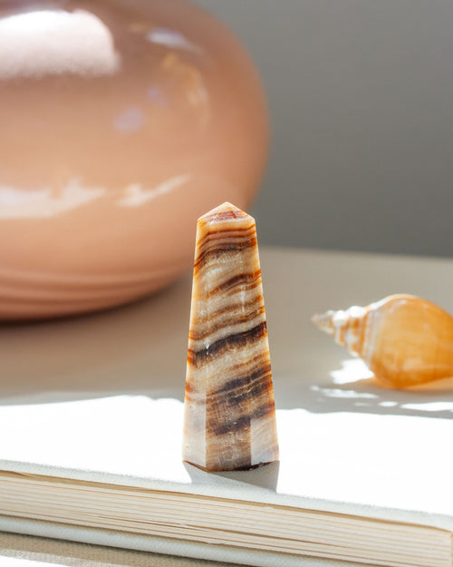 Small calcite mini obelisk with desert stripes