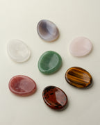 Smooth stones in white, pink, green, red, and brown
