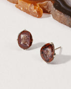 Down to Earth Post Earrings with reddish-brown geode in a sterling silver bezel setting.