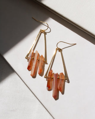 Gold and peach quartz stone drop triangle shaped fish hook earrings.