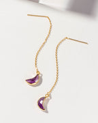 Gold Eclipse threader earrings with Amethyst gemstones on a white background.