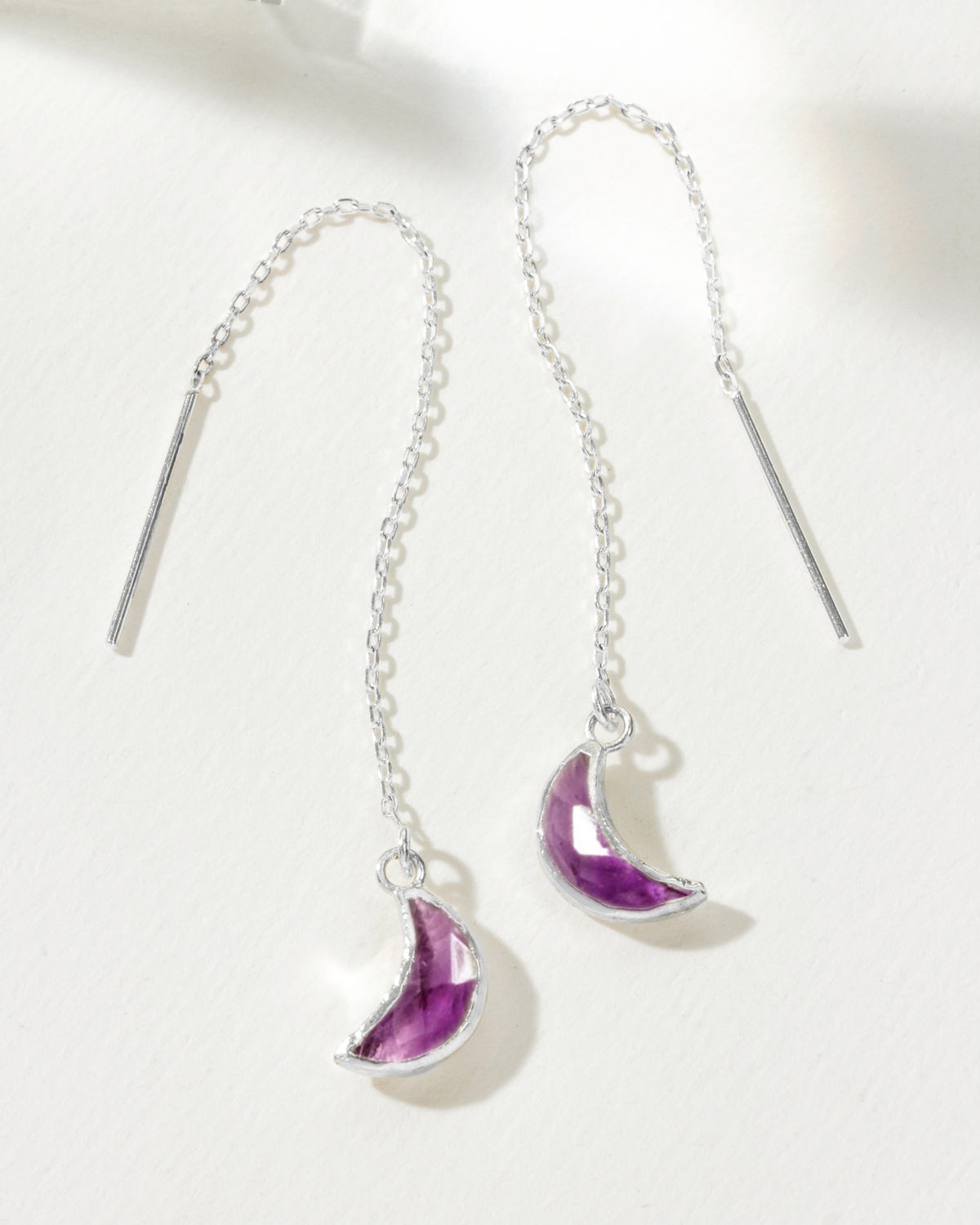 Two Eclipse Threader Earrings in Sterling Silver with Amethyst gemstone crescent moons.