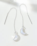 Two sterling silver Eclipse Threader Earrings with moonstone crescent pendants are