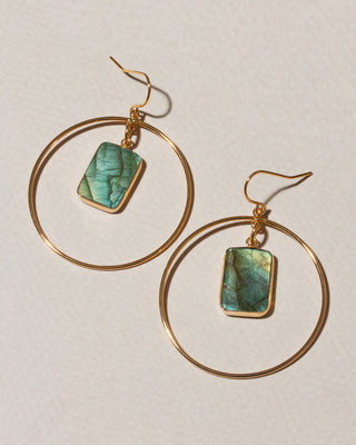 A pair of gold hoop dangle earrings with rectangular green labradorite stone charms.
