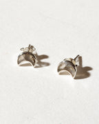 Pair of sterling silver post earrings with a crescent shape, with bezel-set labradorite stones.