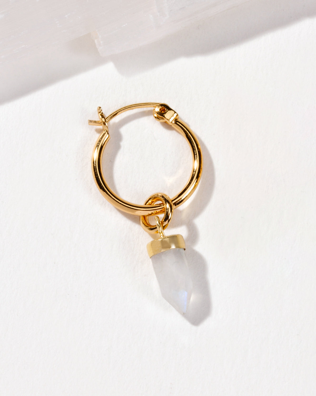 On Point Solo Hoop Earring Gold with Moonstone charm detail.