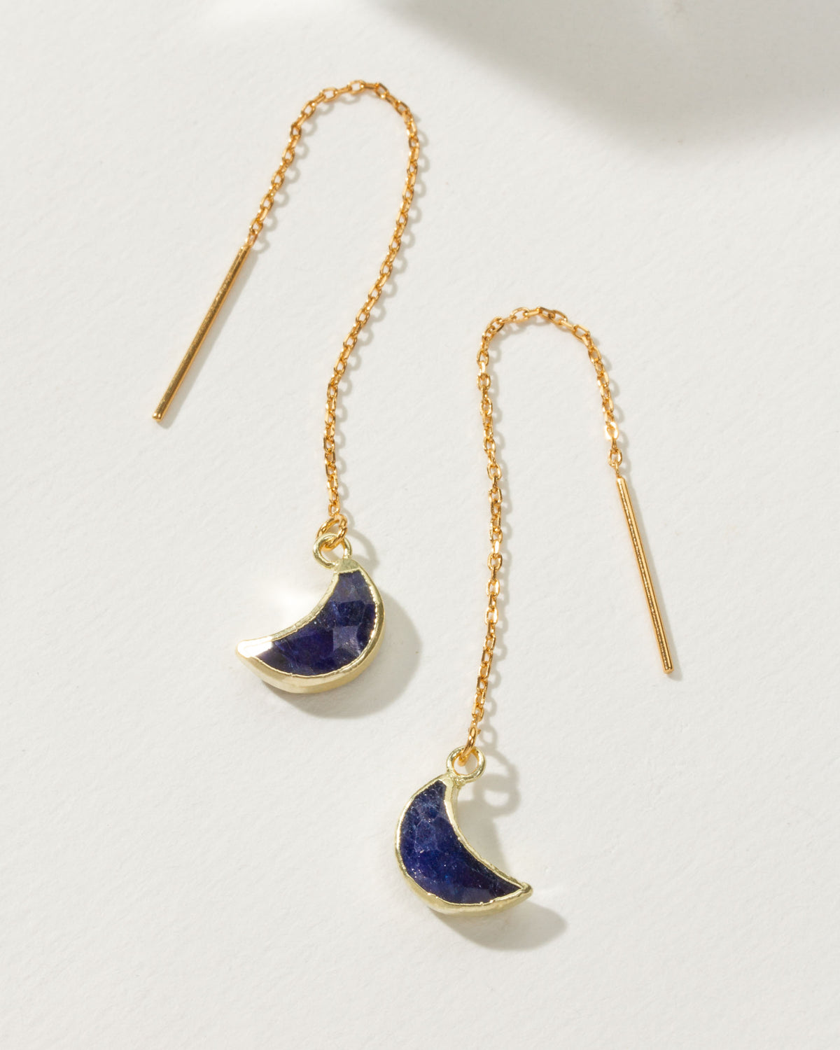 Gold Eclipse Threader Earrings with a sapphire gemstone crescent moon.