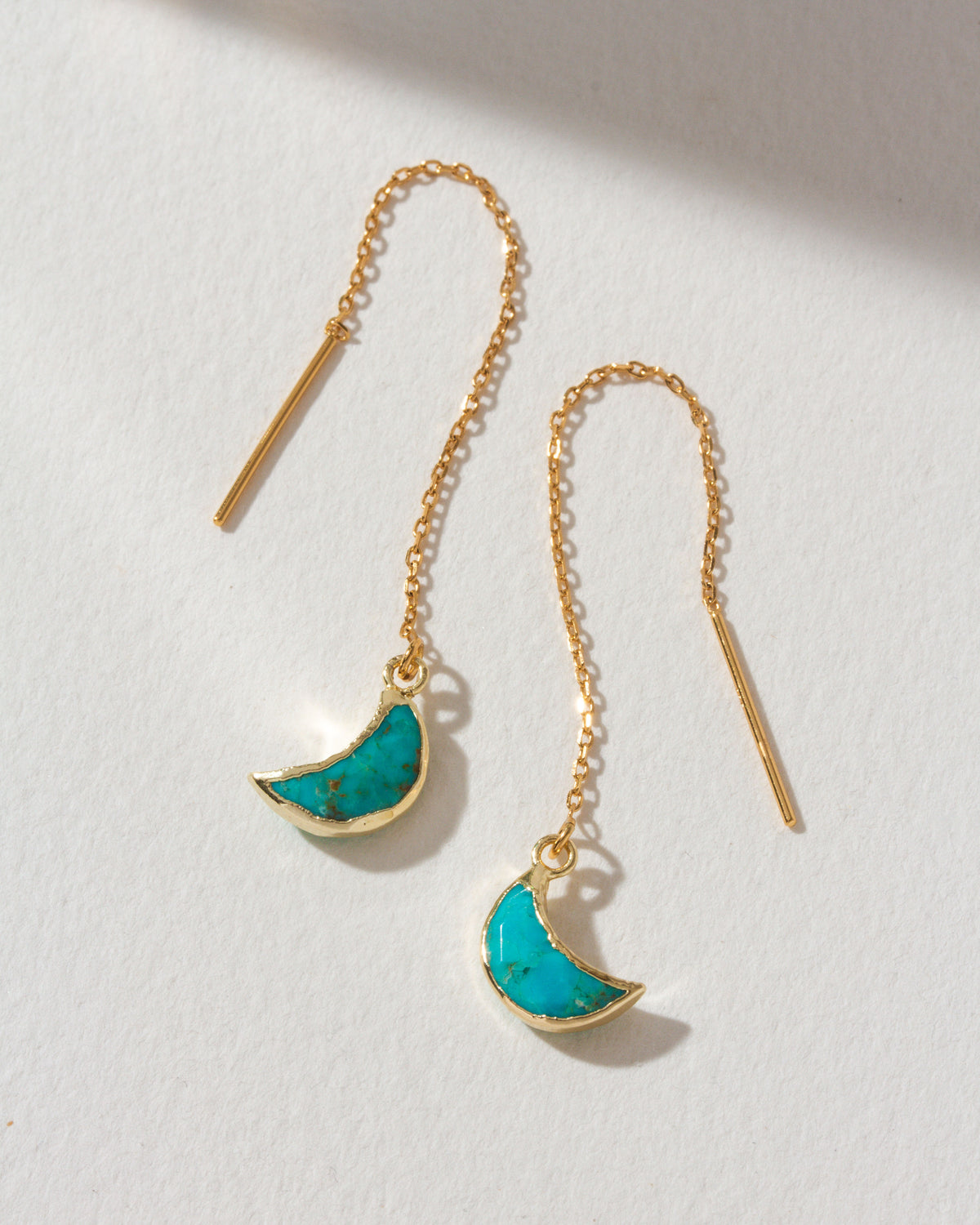 Gold Eclipse threader earrings with turquoise gemstone crescent moon charm.