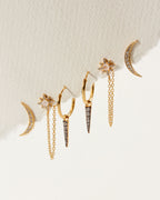 Twilight earring set with gold moon climbers, moonstone star studs, and charm hoops