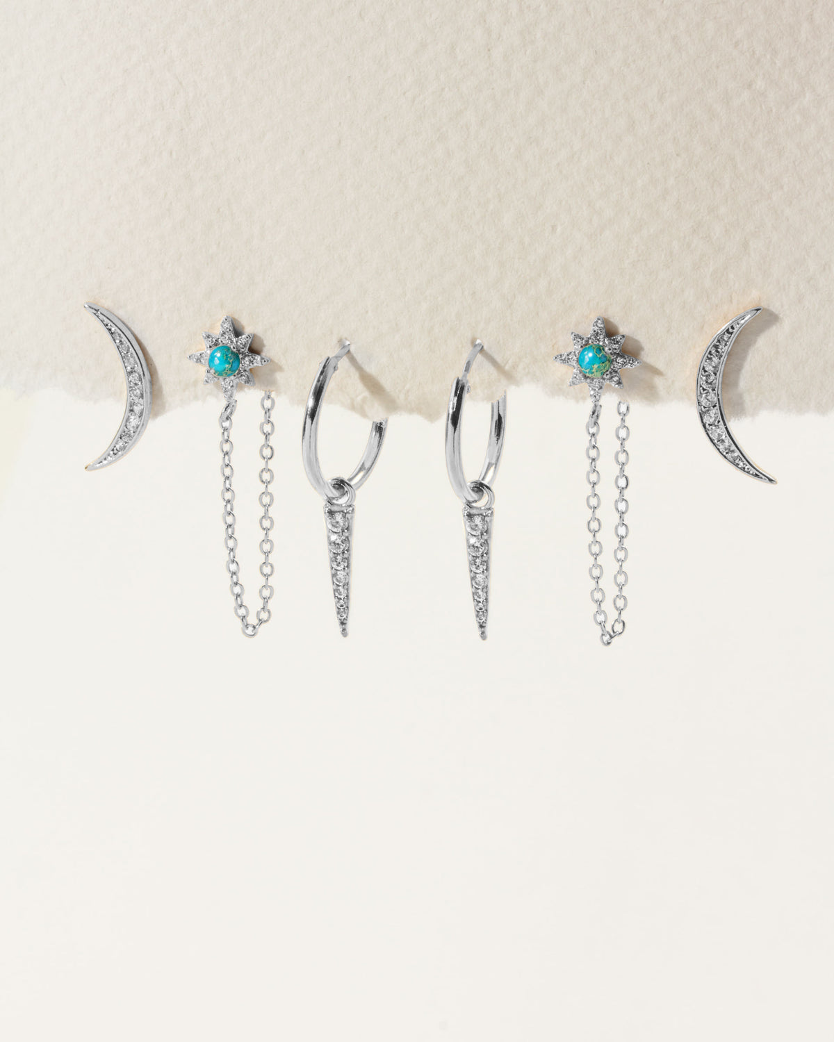 Set of 3 pair of silver plated dainty celestial earrings with turquoise stones.