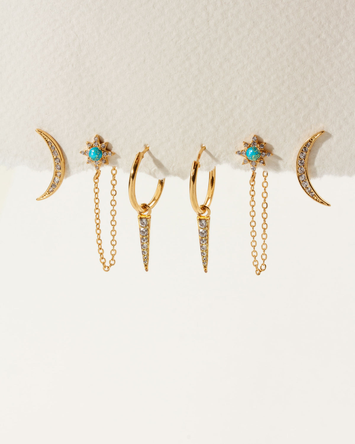 Set of 3 pair of gold celestial dainty earrings with turquoise and clear cubic zirconia stones.