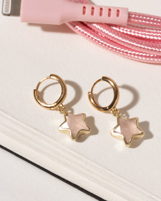 Rose quartz star charm gold huggie hoop earrings.