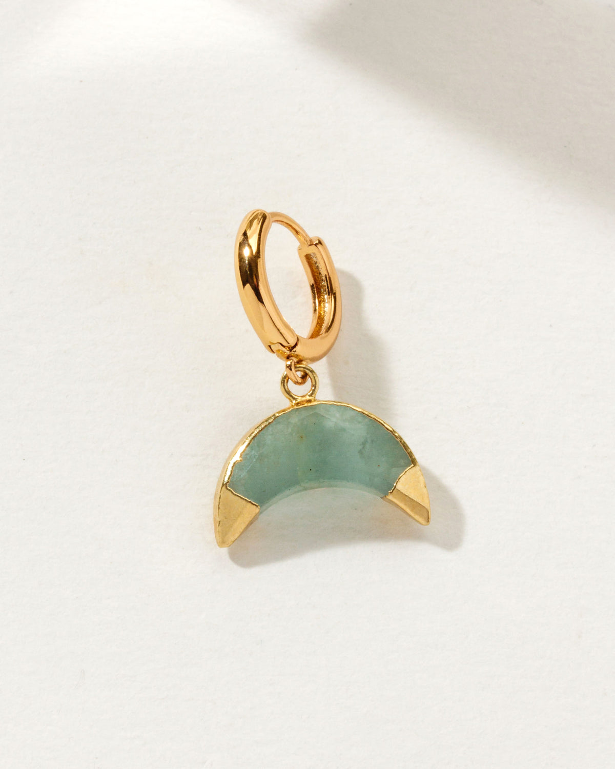 Celestial Curve Solo Hoop Earring with an Aquamarine gemstone.
