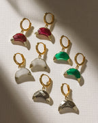 Crescent Horn Huggie Hoop Earrings in ruby, moonstone, pyrite, and green chalcedony.