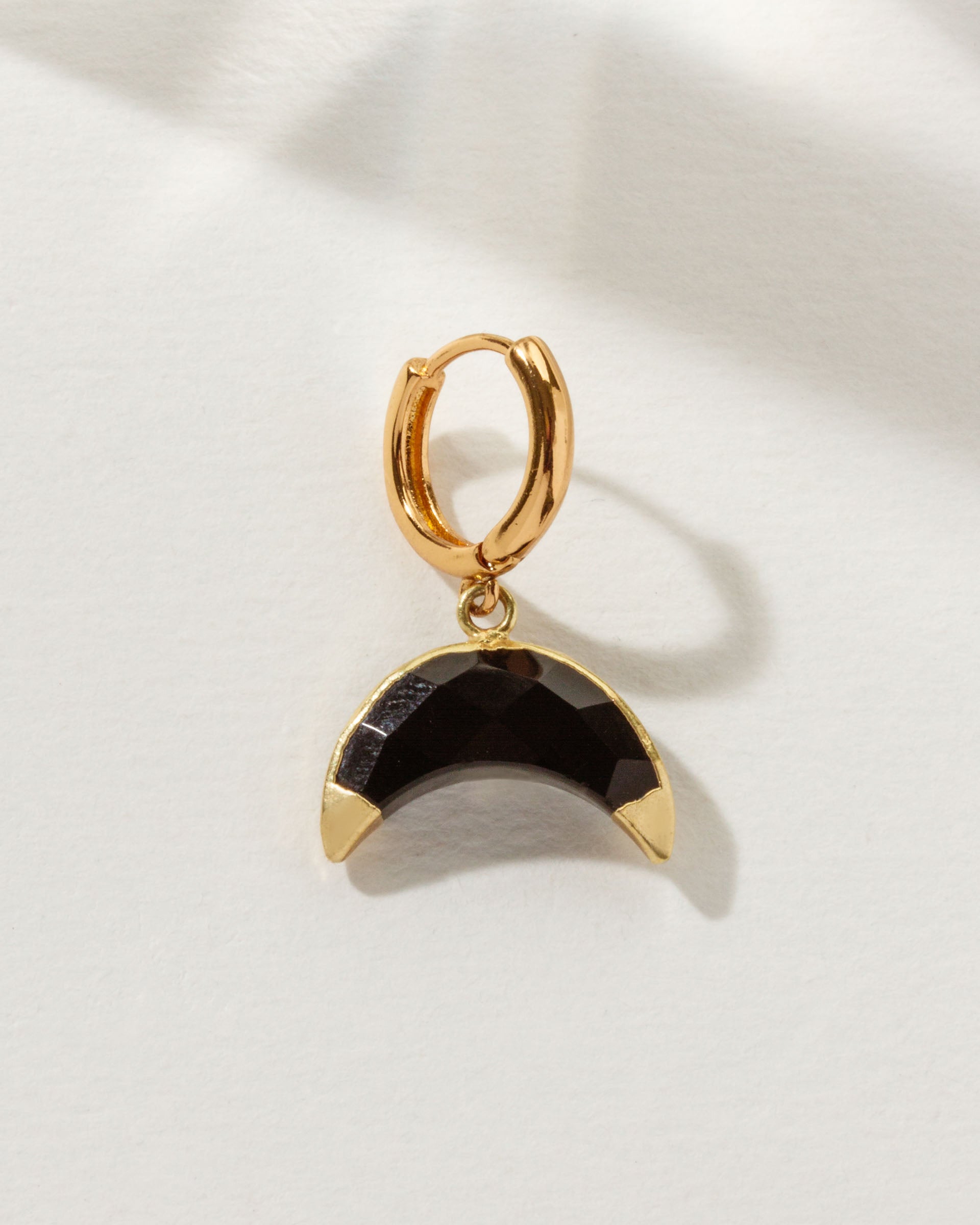 Celestial Curve Solo Hoop Earring with Onyx crescent gemstone and gold huggie hoop.