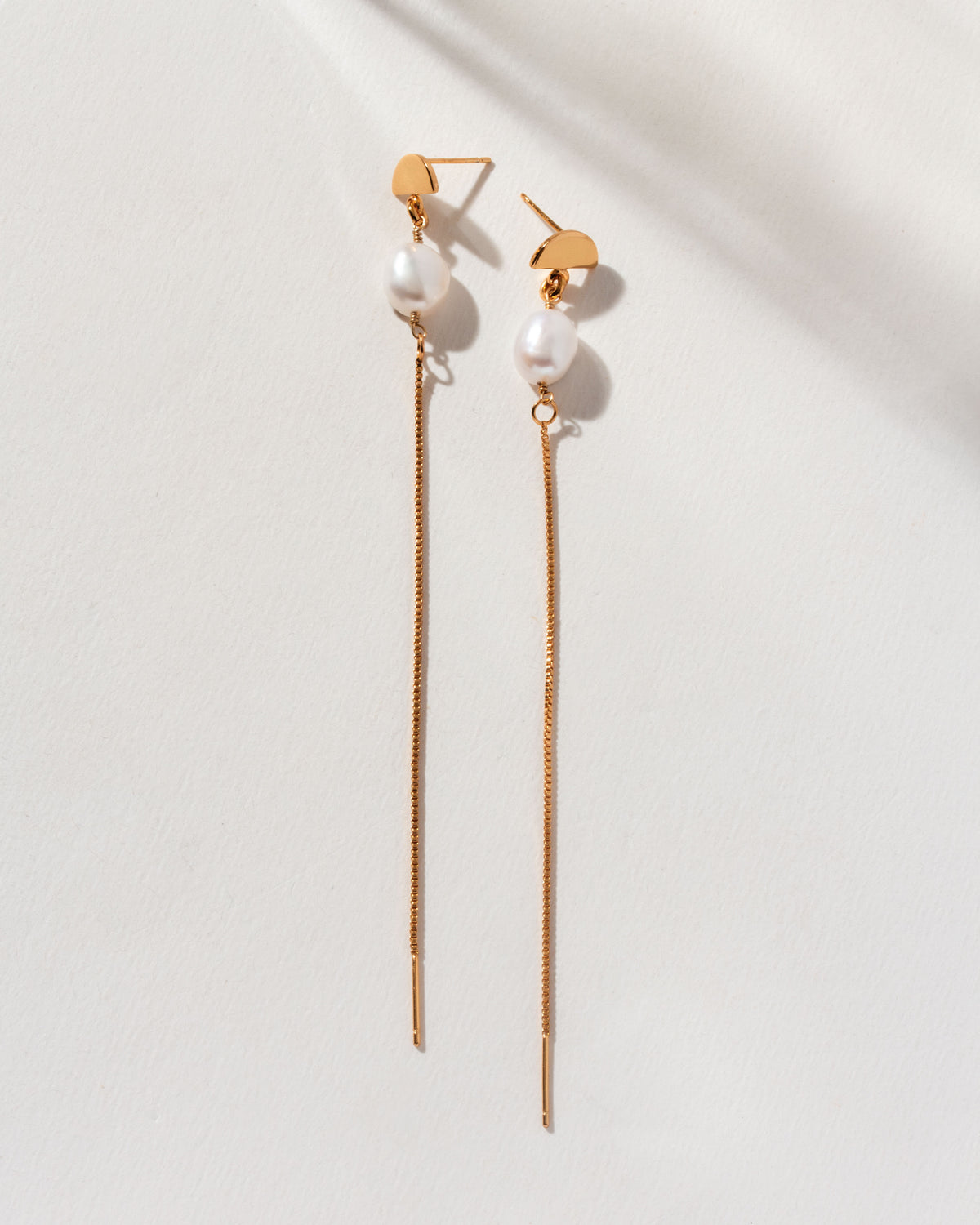 Two Art Deco Pearl Threader Earrings with gold metal and a freshwater pearl detail