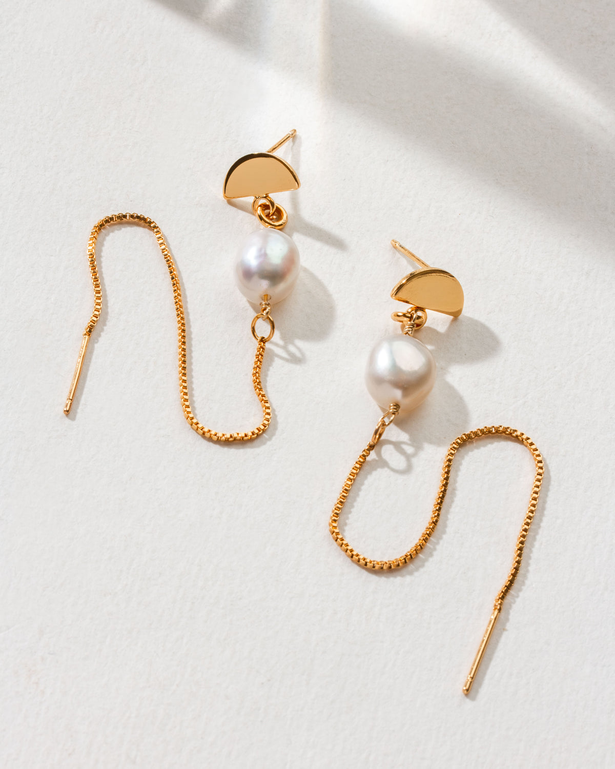 Art Deco Pearl Threader Earrings with gold chain and pearl accent.