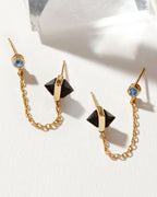 Midnight Serenade double-piercing earrings with crystal stud, onyx pyramids, and gold chain
