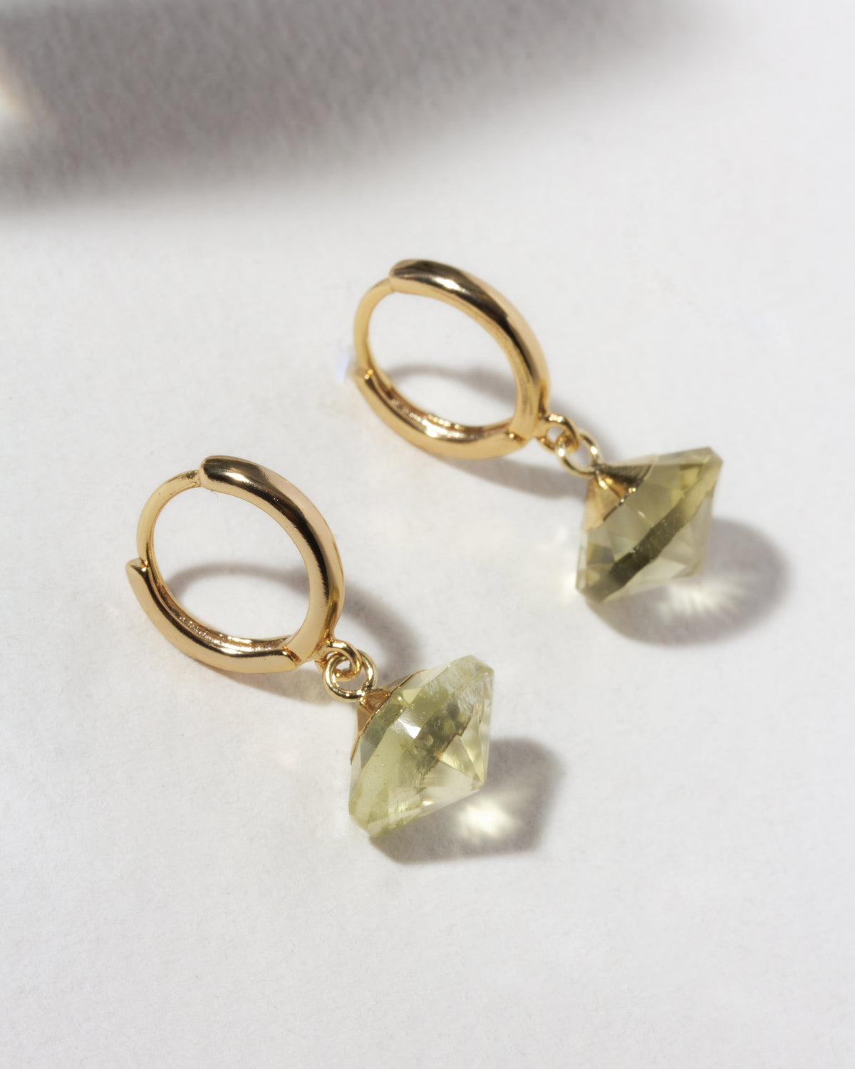 Gold huggie hoop with yellow limon quartz UFO shaped charm