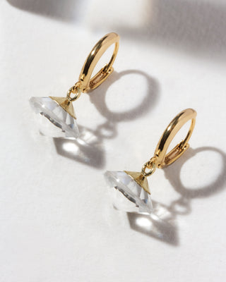 Gold huggie hoop with clear quartz UFO shaped charm