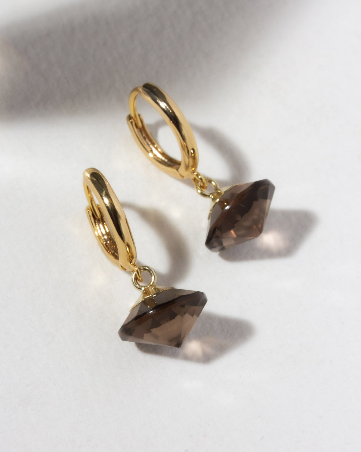 Gold huggie hoop with brown smoky quartz UFO shaped charm
