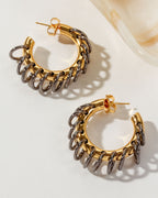 Two Golden Eclipse Vertebrae Post Hoop Earrings featuring gold hoops and oxidized metal links.